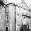 Spylaw House, Bridge Road, Colinton.
View from North East showing late eighteenth century North elevation, with curved double stair, and iron balcony at first floor level.