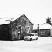 View of farmhouse and cowshed