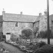 View of farmhouse from NW.