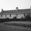 View of farmhouse from SE.