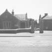 View of lodge including gatepiers from North.