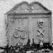 Glendevon Parish Church, Churchyard.
General view of tombstone with scales and merchant's '4'sign, skull, crossed bones and hourglass.
Insc:'1716. Memento Mori. A.F. I.F'.