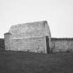 View from SE of vaulted building to N of range of associated farm buildings.
