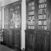 Interior view of Stracathro House showing bookcases in library.