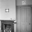 Interior view of Belvedere, Stracathro House, showing detail of door and fire place.