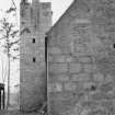 View of courtyard with tower with weathervane behind barn, Aboyne Castle.