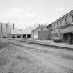 Glasgow, Springburn, St Rollox Locomotive Works.
General view from East of exterior of (left and right) boiler house, crane shop and erecting shop.