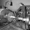 Glasgow, Springburn, St Rollox Locomotive Works, interior.
View of carriage wheel turning lathe in operation.