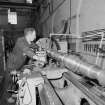 Glasgow, Springburn, St Rollox Locomotive Works, interior.
View of carriage axle turning lathe in operation.