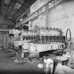 Glasgow, Springburn, St Rollox Locomotive Works, interior.
Large diesel-engine locomotive diesel engine under repair.