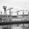 Cartsburn Shipyard. View of cranes from W.