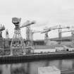Cartsburn Shipyard. General view of cranes from W