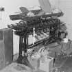 Glasgow, 171 Boden Street, Viyella Weaving Factory.
Detail of early 'Leesona' pirn winding machine in sizing department.