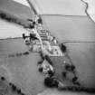 Oblique aerial view centred on church from S.