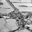 Oblique aerial view centred on the village of Longformacus with walled garden, church and burial ground adjacent, taken from the S.