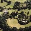 Oblique aerial view centred on the country house and stables, taken from the NNW.
