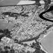 Oblique aerial view centred on the town of Coldstream with road bridge adjacent, taken from the SW.