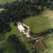 Oblique aerial view centred on the country house with walled garden adjacent, taken from the SSE.