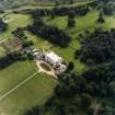 Oblique aerial view centred on the country house with walled garden adjacent, taken from the N.