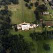 Oblique aerial view centred on the country house with walled garden adjacent, taken from the SW.