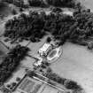 Oblique aerial view centred on the country house with walled garden adjacent, taken from the ESE.