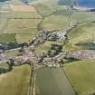General oblique aerial view looking across the village towards St Abbs and the coast, taken from the SW.