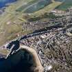 Oblique aerial view centred on the harbour, taken from the NW.