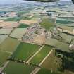 General oblique aerial view looking across the town of Chirnside, towards the North Sea coastline in the distance, taken from the SW.