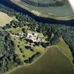 Oblique aerial view centred on the country house, taken from the NW.