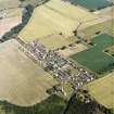 Oblique aerial view centred on the village, taken from the NW.