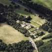 Oblique aerial view of Abbotsford centred on the country house with tea room, gardens and stables adjacent, taken from the E.