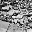 Oblique aerial view from the NE centred on the remains of the Abbey.