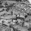 Oblique aerial view of Melrose centred on Harmony house and the remains of the abbey, taken from the N.
