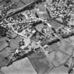 Oblique aerial view centred on abbey from NE.