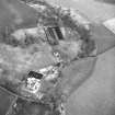 Oblique aerial view centred on country house from W.