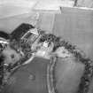 Oblique aerial view centred on country house from SSE.