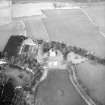 Oblique aerial view centred on country house from SSE.