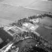Oblique aerial view centred on country house from SSW.