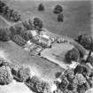 Oblique aerial view centred on country house from SW.