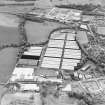 Oblique aerial view centred on the bonded stores of the Carsebridge Distillery, Alloa, taken from the N