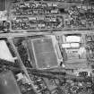 Oblique aerial view centred on the football ground, taken from the N