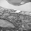 Oblique aerial view of southern Alloa and industrial units close to the River Forth, centred on the gasworks, taken from the N