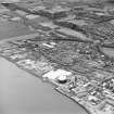 Oblique aerial view of southern Alloa and industrial units close to the River Forth, centred on the gasworks, taken from the SSE
