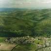 General oblique aerial view looking over Menstrie village towards Menstrie Glen, taken from the SE.