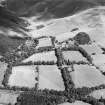 General oblique aerial view looking across the farmsteading towards the country house and stables, taken from the WSW.