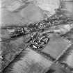 Oblique aerial view centred on village from E.