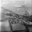 Oblique aerial view centred on village from NE.