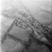 Oblique aerial view centred on village from N.