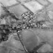 Oblique aerial view centred on village from W.