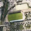 Oblique aerial view centred on the football stadium, taken from the E.